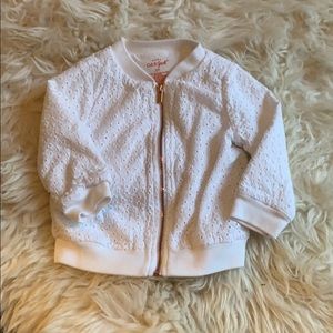 Eyelet white bomber jacket.